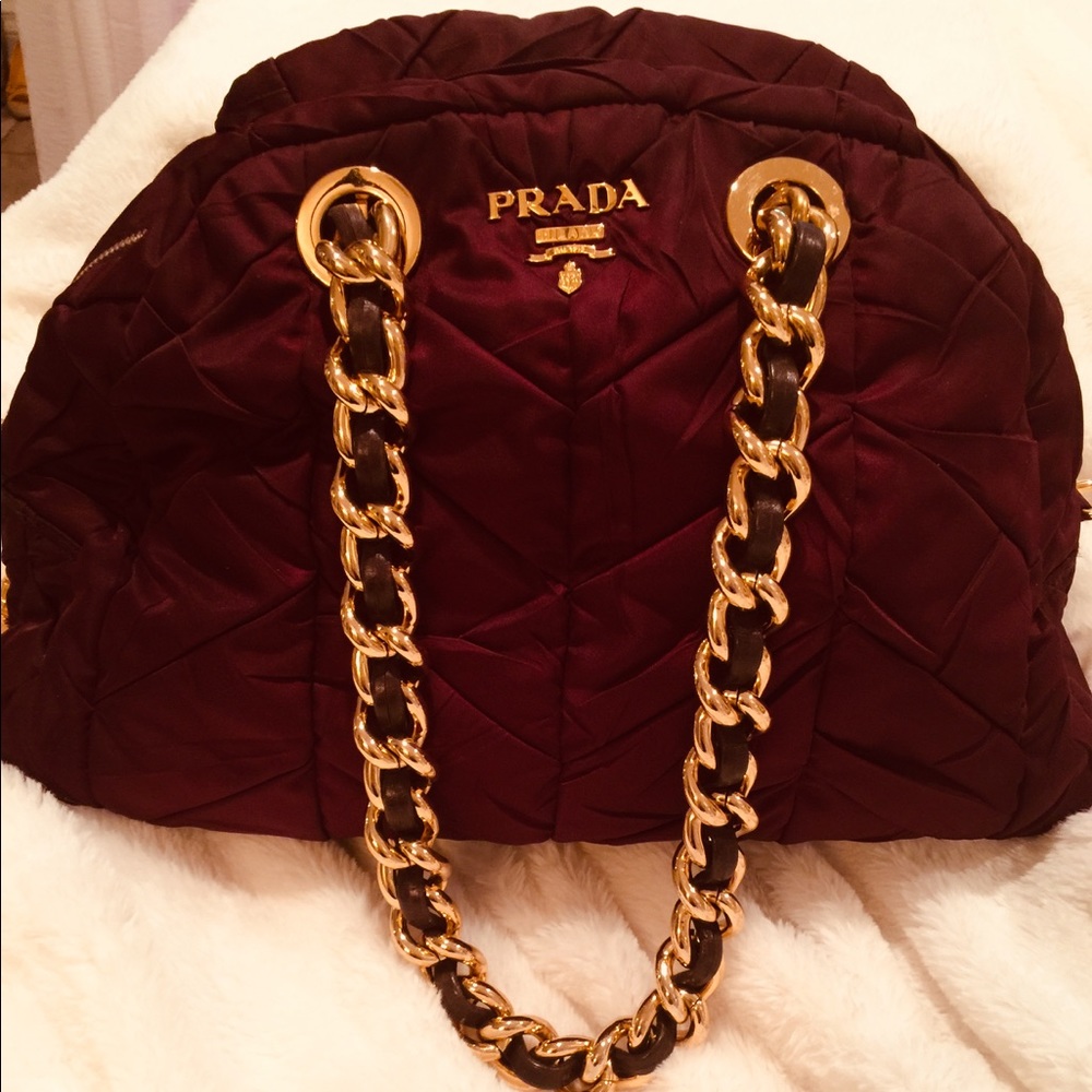 PRADA BURGUNDY HANDBAG WITH GOLD ACCENT